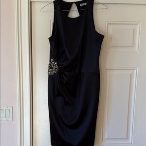 Elegant Black Sleeveless Dress with Embellished Detail